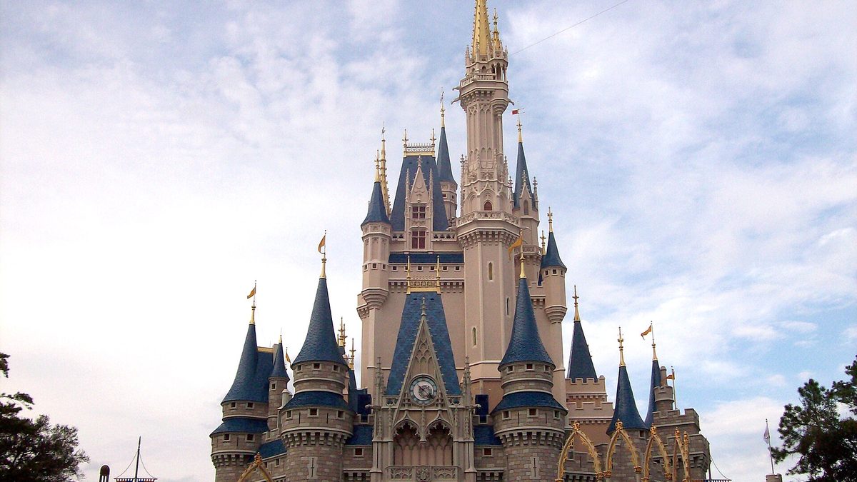 Cinderella Castle at Magic Kingdom, Walt Disney World in Florida, taller and set against a blue sky